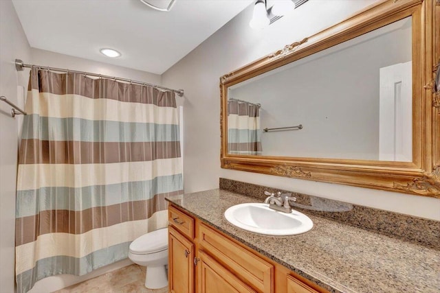 bathroom with tile patterned floors, vanity, toilet, and walk in shower