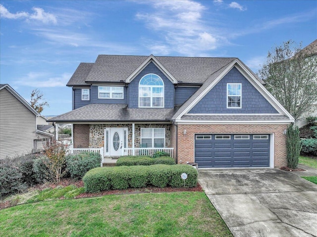 view of front facade featuring brick siding, a porch, and driveway