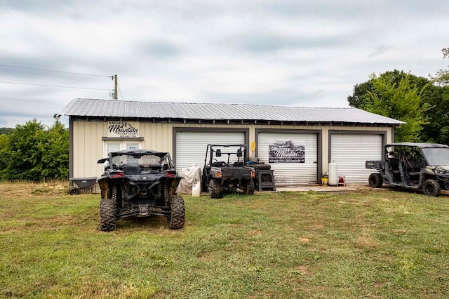 garage featuring a lawn