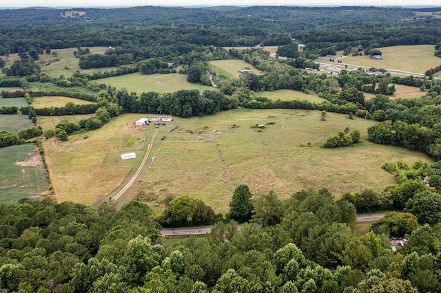 birds eye view of property with a rural view