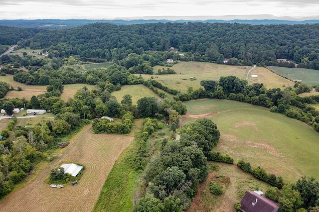 birds eye view of property with a rural view