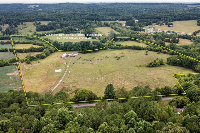 birds eye view of property featuring a rural view