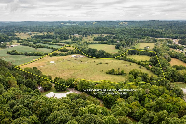 birds eye view of property with a rural view