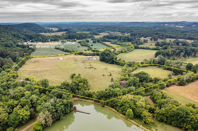 aerial view with a rural view and a water view