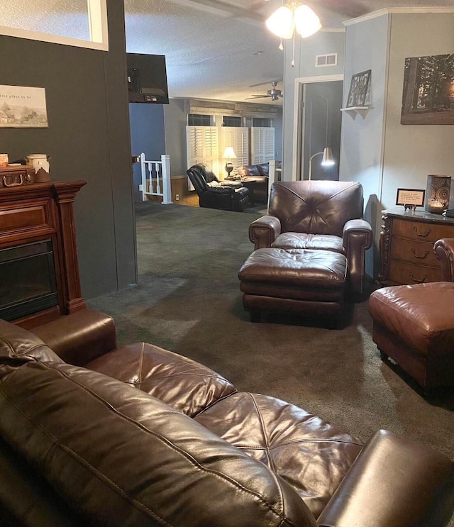 carpeted living room with ceiling fan and crown molding