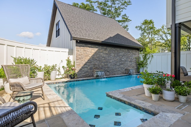 view of pool with pool water feature