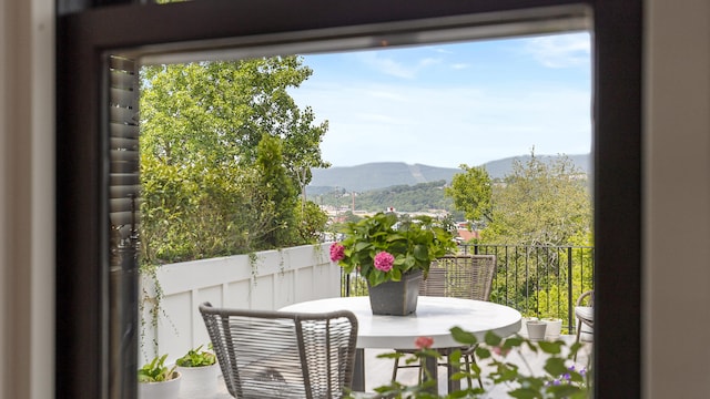 balcony featuring a mountain view