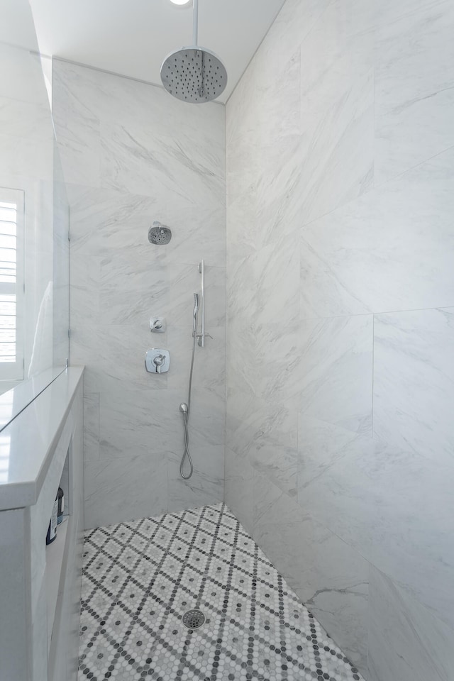 bathroom with a tile shower