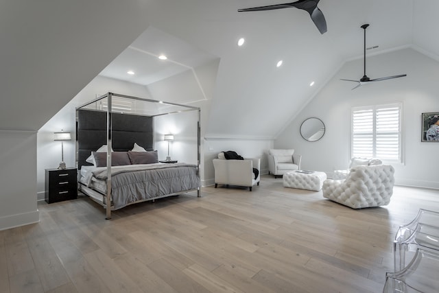 bedroom featuring light hardwood / wood-style floors, ceiling fan, and lofted ceiling