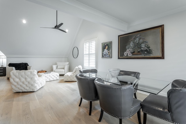 dining room featuring vaulted ceiling with beams, light hardwood / wood-style floors, and ceiling fan