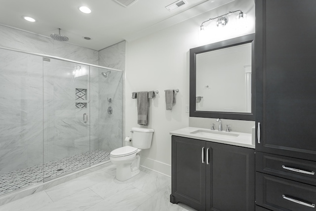 bathroom with toilet, vanity, and walk in shower