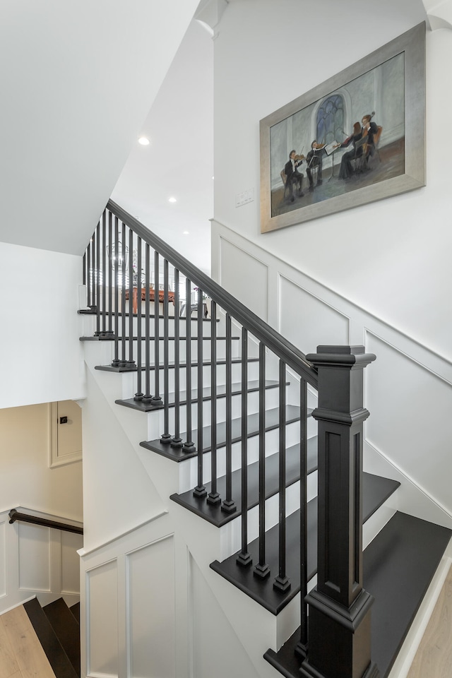 stairs with wood-type flooring