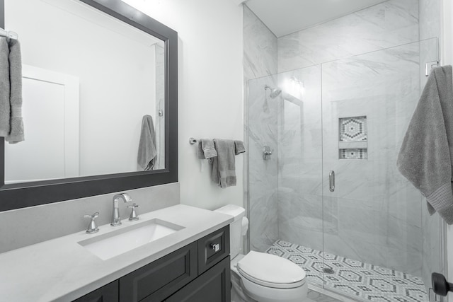 bathroom with vanity, toilet, and walk in shower