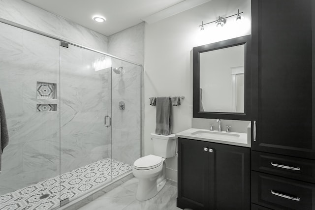 bathroom featuring vanity, an enclosed shower, and toilet