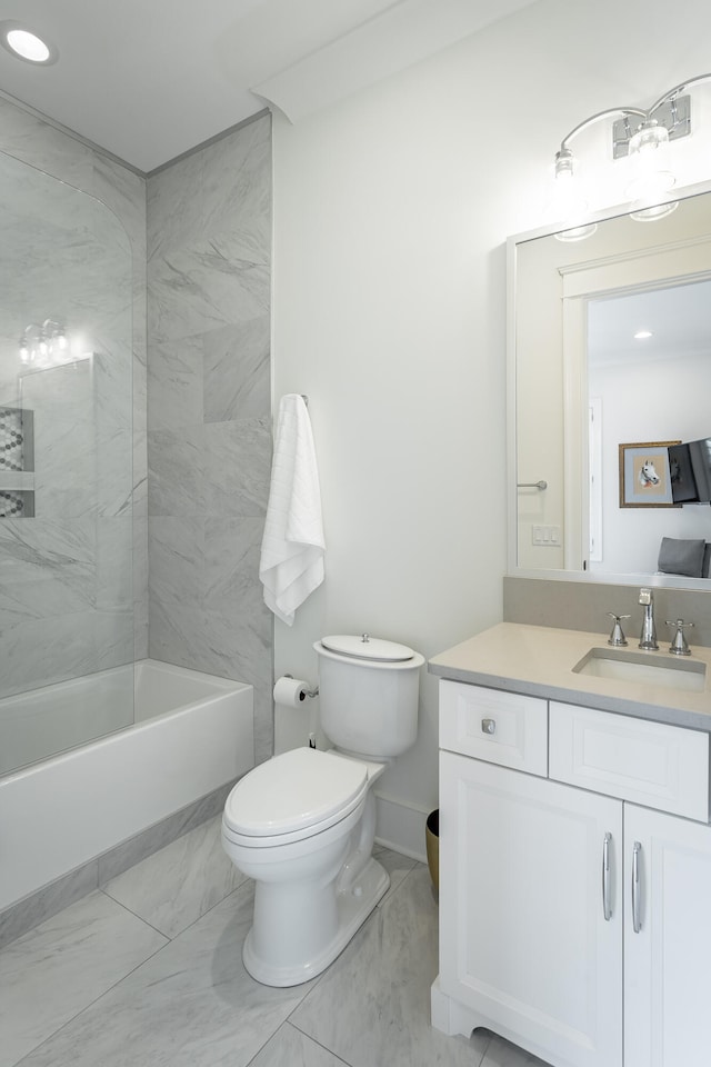 full bathroom featuring vanity, toilet, and tiled shower / bath combo