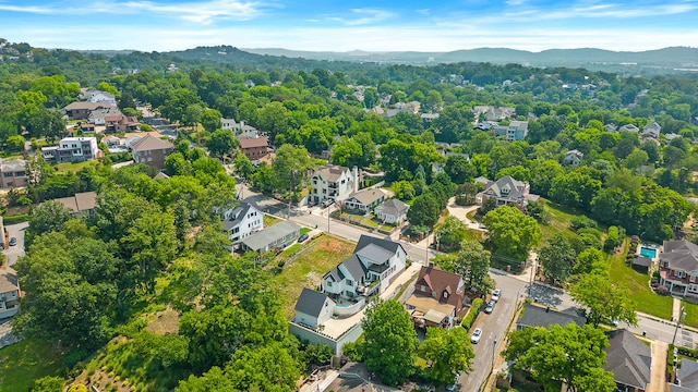 birds eye view of property featuring a mountain view