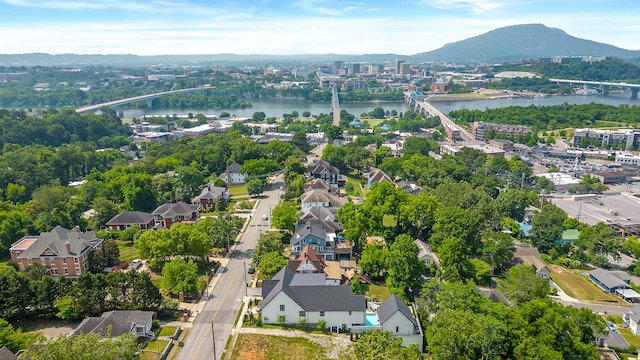 drone / aerial view with a water and mountain view