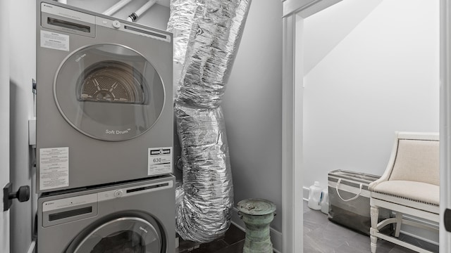 laundry area with stacked washer / drying machine