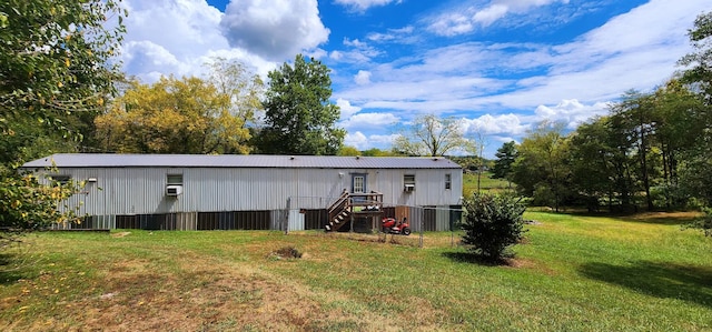 back of house featuring a lawn