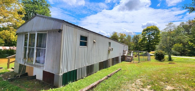 view of property exterior with a yard