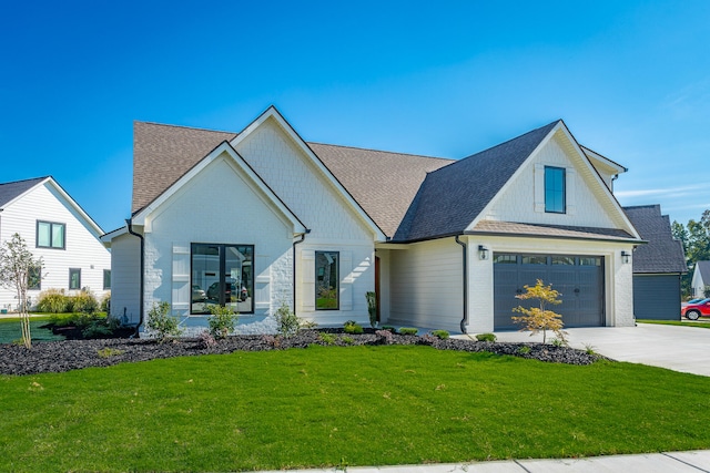 modern farmhouse style home featuring a front lawn and a garage