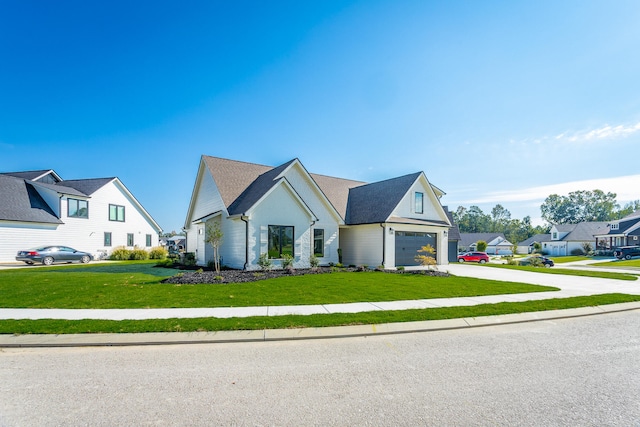 modern farmhouse style home with a garage and a front yard