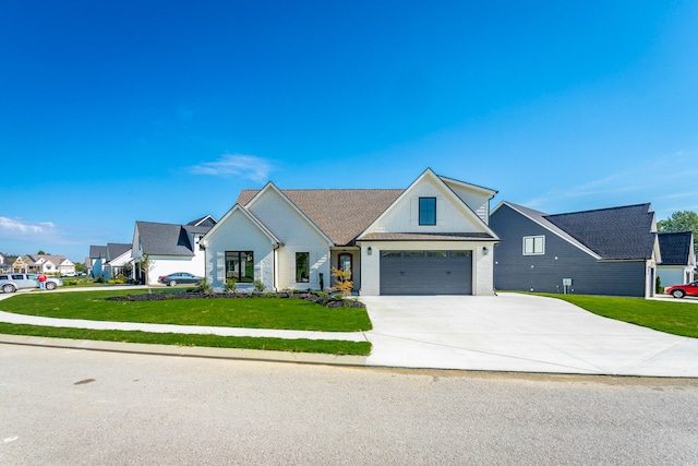 modern farmhouse featuring a garage and a front lawn