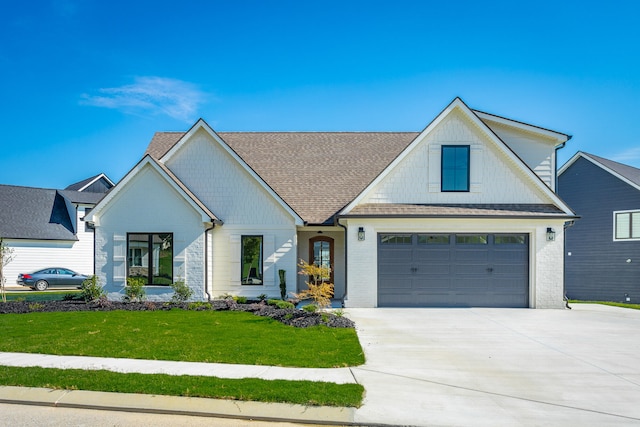 modern farmhouse with a garage and a front yard