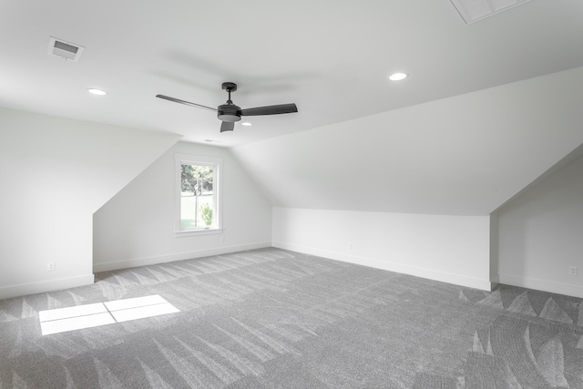 bonus room featuring light carpet, lofted ceiling, and ceiling fan