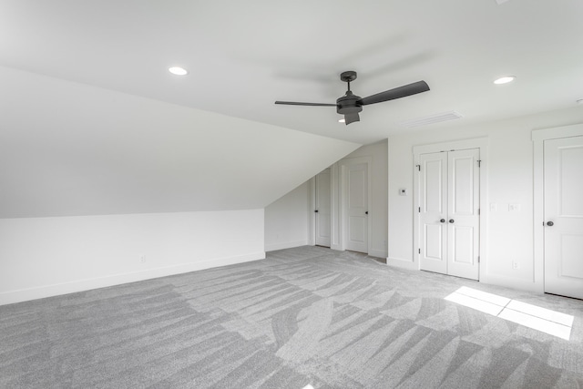 bonus room featuring vaulted ceiling, ceiling fan, and light colored carpet