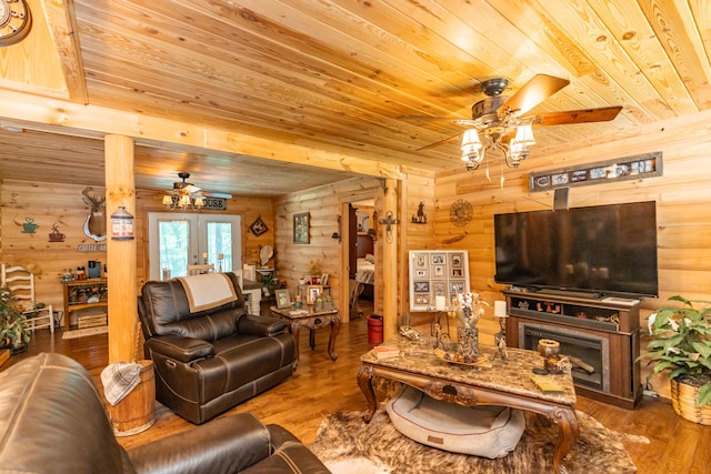 living room featuring french doors, wood-type flooring, ceiling fan, and wood ceiling