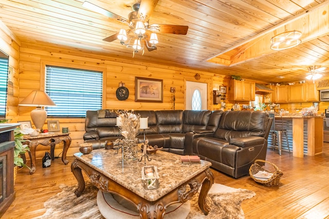 living room featuring plenty of natural light, ceiling fan, and light hardwood / wood-style floors