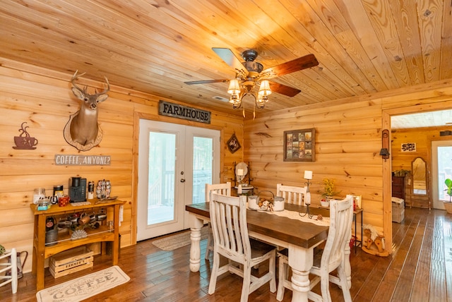 dining room with french doors, dark wood-type flooring, ceiling fan, and wood ceiling