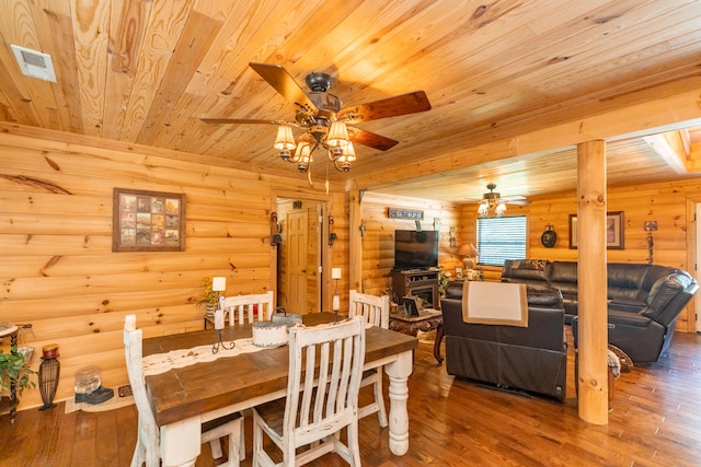 dining area with wooden ceiling, hardwood / wood-style flooring, ceiling fan, and rustic walls