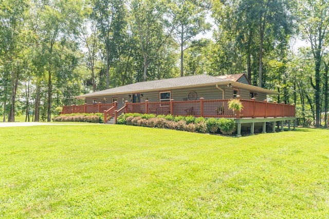 exterior space with a yard and a wooden deck