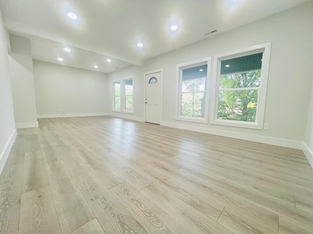 spare room with light hardwood / wood-style flooring