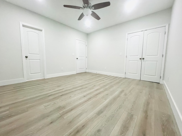 unfurnished room with ceiling fan and light hardwood / wood-style floors