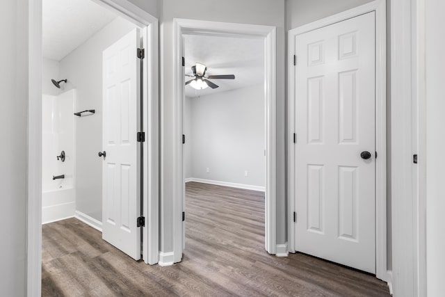 corridor featuring hardwood / wood-style floors