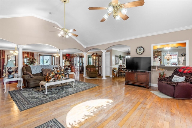 living room featuring lofted ceiling, wood-type flooring, ceiling fan, and decorative columns