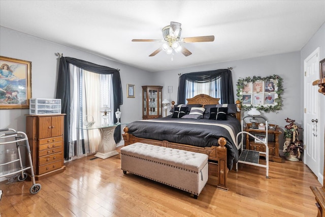 bedroom featuring light wood-type flooring and ceiling fan