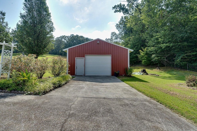 garage featuring a yard