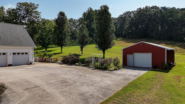 garage featuring a lawn