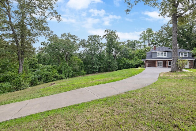 exterior space with a front lawn