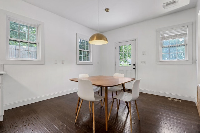 dining area featuring dark hardwood / wood-style floors