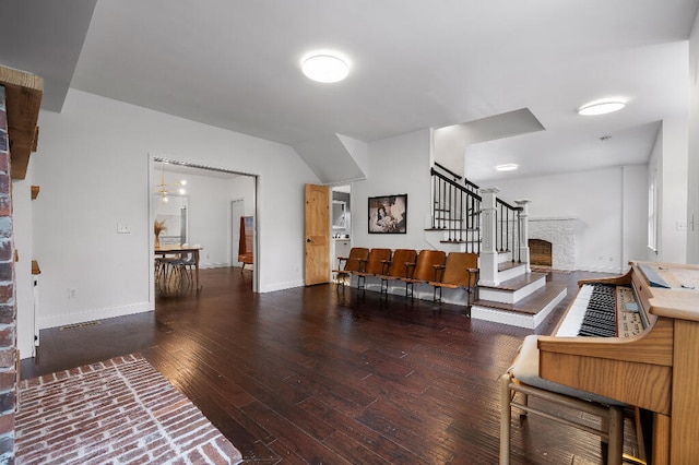 living room featuring dark wood-type flooring