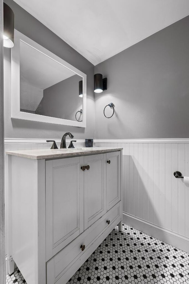 bathroom featuring wainscoting and vanity