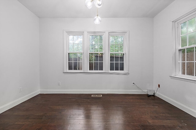 empty room featuring dark hardwood / wood-style floors