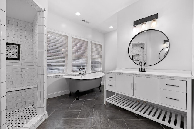 bathroom with vanity, plus walk in shower, and tile patterned floors