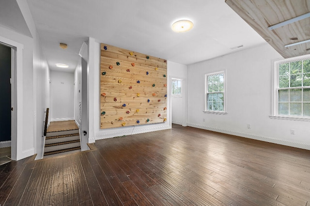 unfurnished living room featuring dark hardwood / wood-style flooring