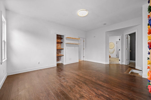 unfurnished living room with hardwood / wood-style floors